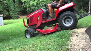 Mowing with a Massey Ferguson GC 1705 Pt1 [upl. by Acinoryt880]